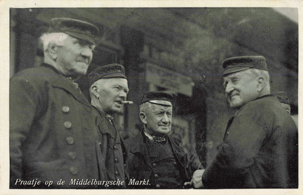 Dutch real photo postcard showing four men chatting at the Middelburgsche Market