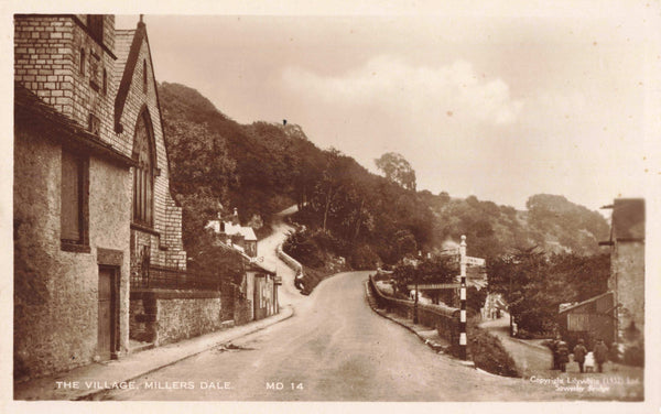 Old real photo postcard of The Village, Millers Dale in Derbyshire