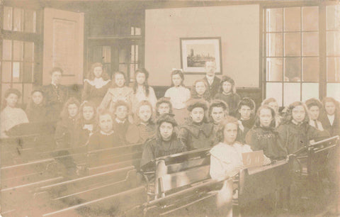 Old postcard of schoolgirls in class, Warwickshire area