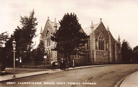 Old real photo postcard of Llandrindod Wells Holy Trinity Church