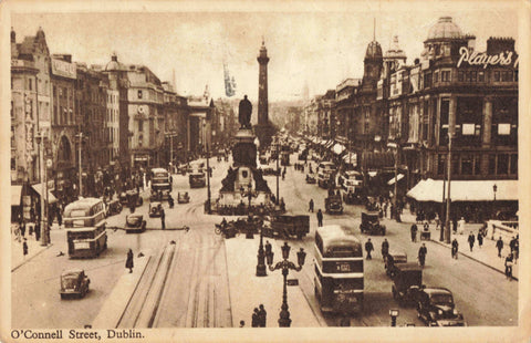 Vintage postcard of O'Connell Street Dublin with double-decker buses and pedestrians