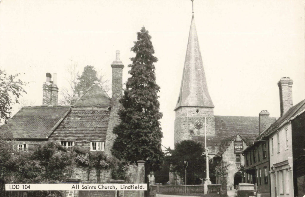 Old real photo postcard of All Saints Church in Lindfield, Sussex