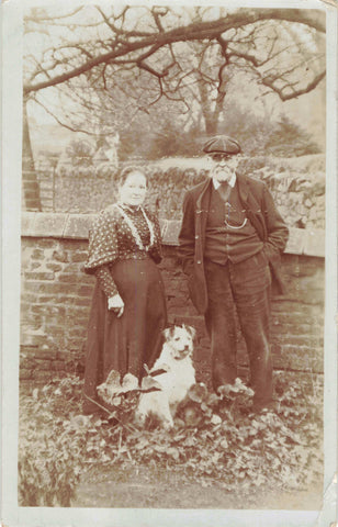 Untitled postcard showing a elderly couple and their dog, probably in Atherstone, Warwickshire