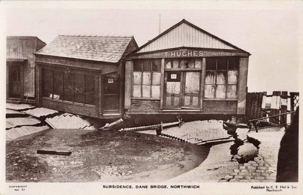 Old real photo postcard showing subsidence at Northwich, T Hughes Shop