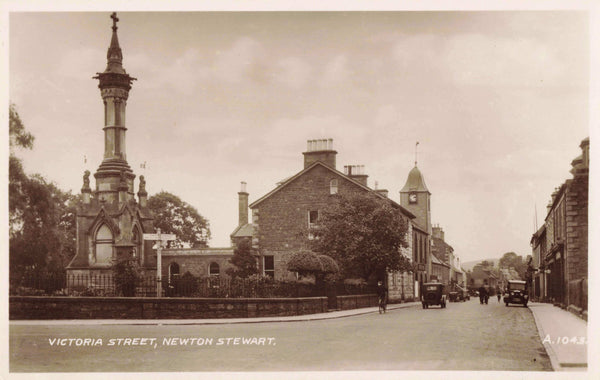 Old real photo postcard of Victoria Street, Newton Stewart in Scotland