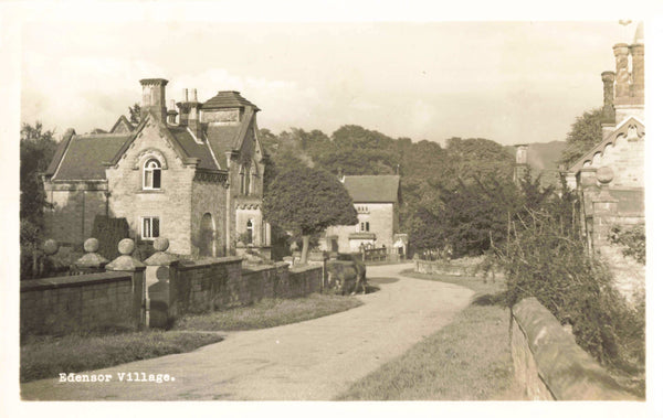 Old real photo postcard of Edensor Village, Derbyshire