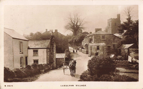 Old real photo postcard of Luxulyan Village in Cornwall