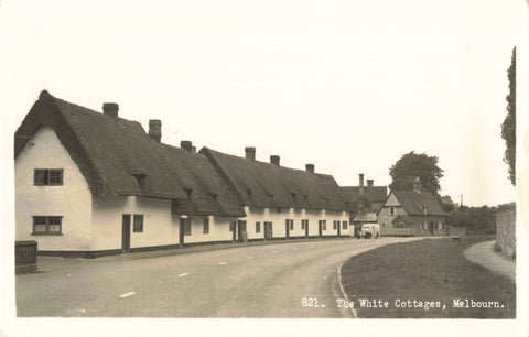 Old real photo postcard of The White Cottages, Melbourn in Cambridgeshire