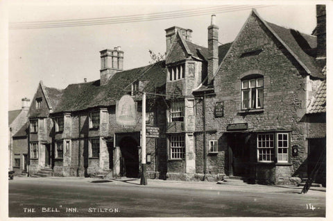 Old real photo postcard of The Bell Inn, Stilton in Cambridgeshire