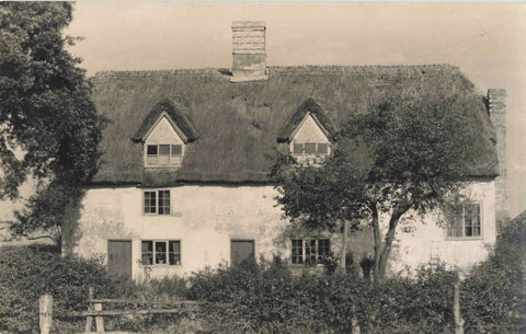 Old real photo postcard, thought to show cottages at Little Gidding in Cambridgeshire