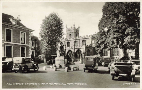 Old real photo postcard of All Saints Church and War Memorial, Huntingdon