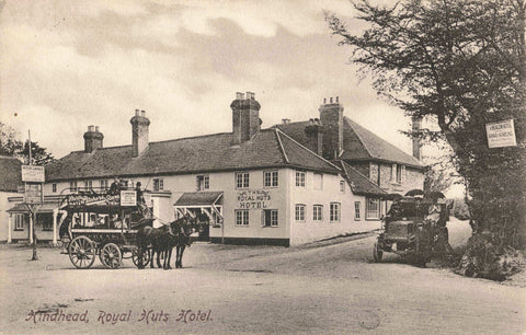 Old postcard of Royal Huts Hotel, Hindhead in Surrey, featuring a horse drawn bus & vintage car