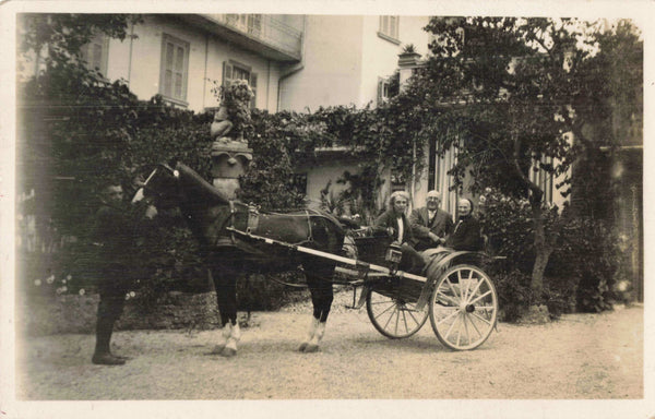 People in horse drawn carriage, real photo postcard