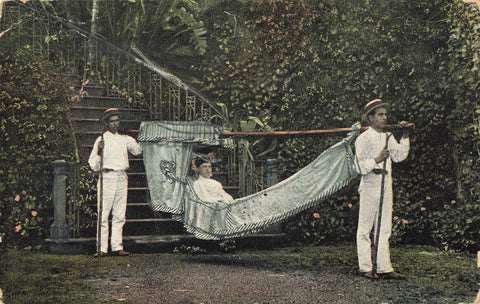 Very early 1900s postcard showing lady in hammock transport in Madeira
