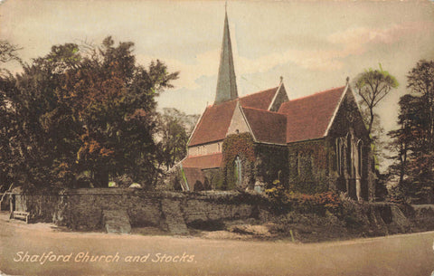 Old postcard of Shalford Church and Stocks, Surrey