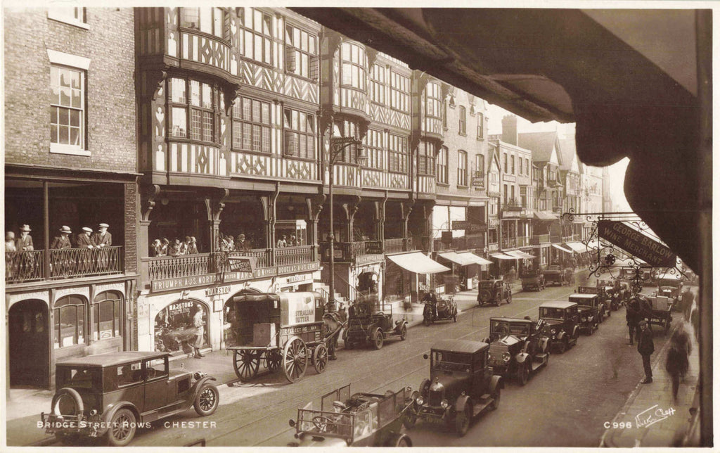 Old real photo postcard of Bridge Street Rows, Chester showing old cars