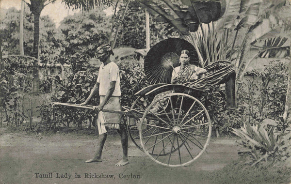 Old postcard of Tamil Lady in Rickshaw, Ceylon