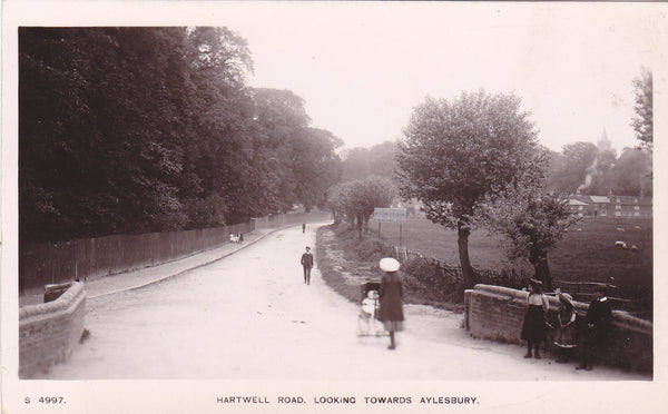 Old real photo postcard entitled Hartwell Road, Looking Towards Aylesbury