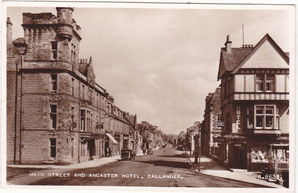 Old real photo postcard of Main Street and Ancaster Hotel, Callander in Perthshire
