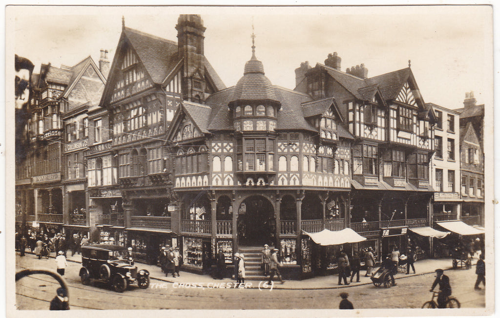 Real photo postcard of The Cross, Chester with vintage car