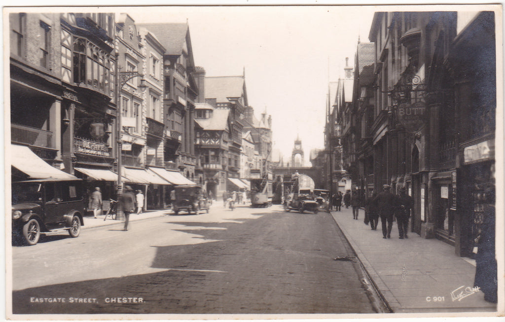 Old real photo postcard of Eastgate Street, Chester