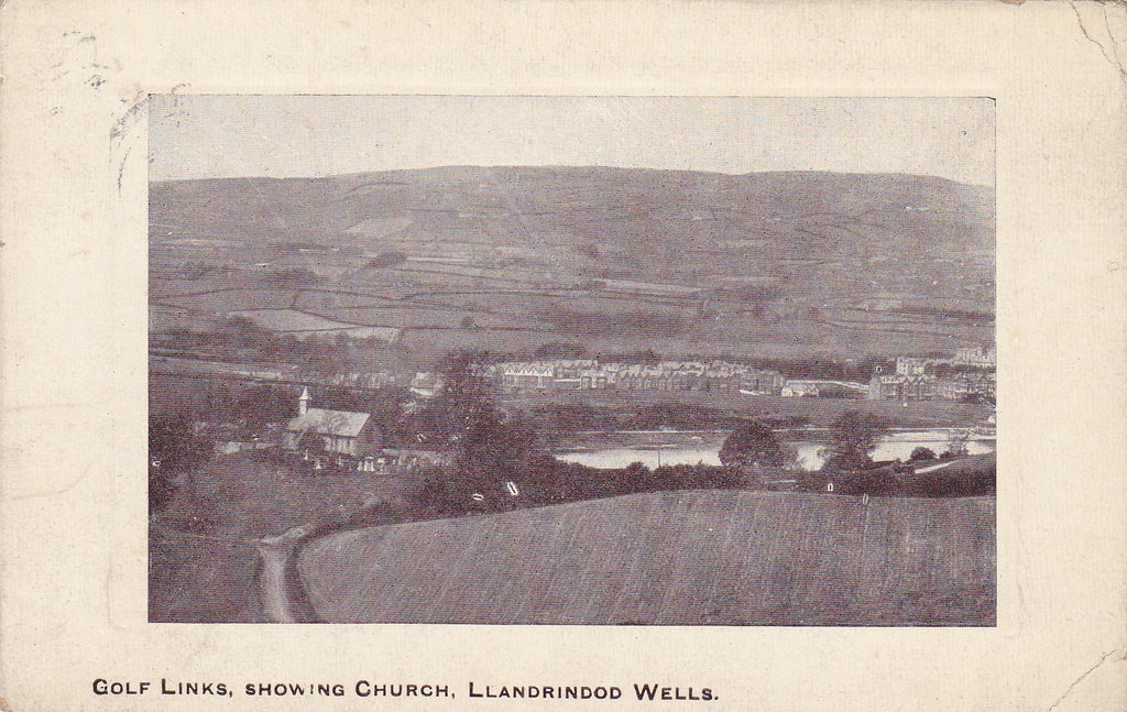 Old postcard of Llandrindod Wells golf links and church