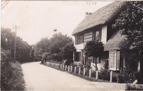 Old real photo postcard of a thatched cottage at North Hayling
