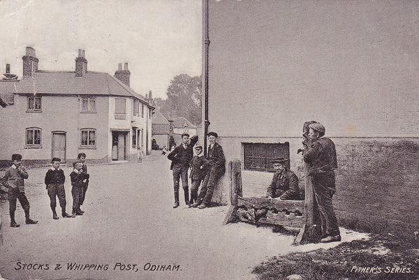 1905 postcard of the Stocks & Whipping Post, Odiham in Hampshire