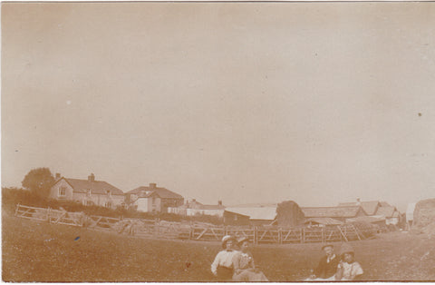 Anonymous people sitting in a Devon field