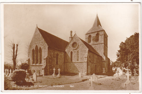 Real photo postcard of Church of St Nicholas, Pevensey in Sussex