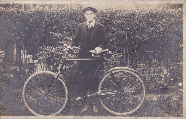 Young man with bicycle, old real photo postcard